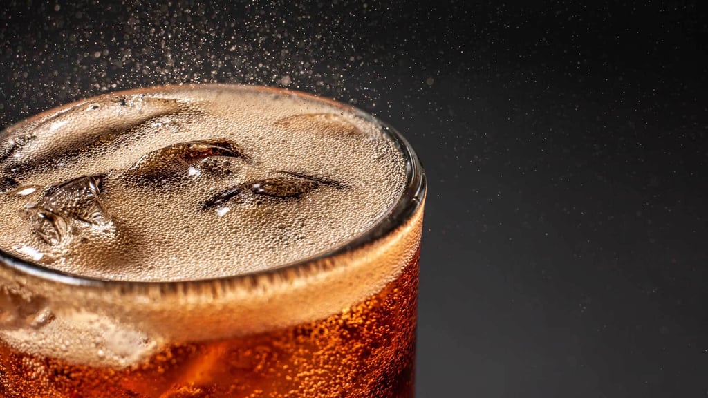 Glass of Fritz coke with ice cubes