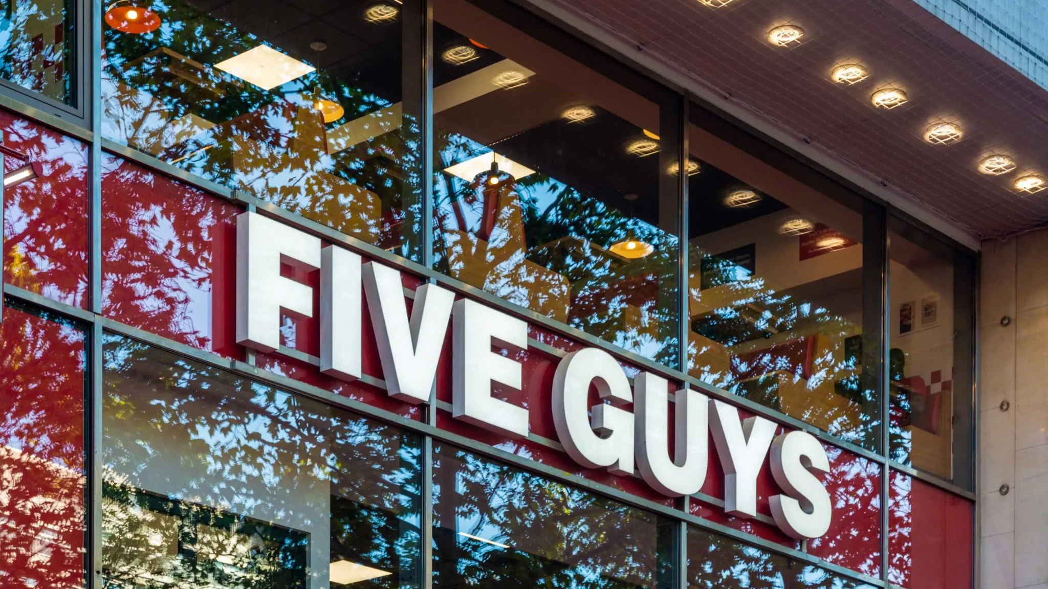 Five Guys signage on restaurant window
