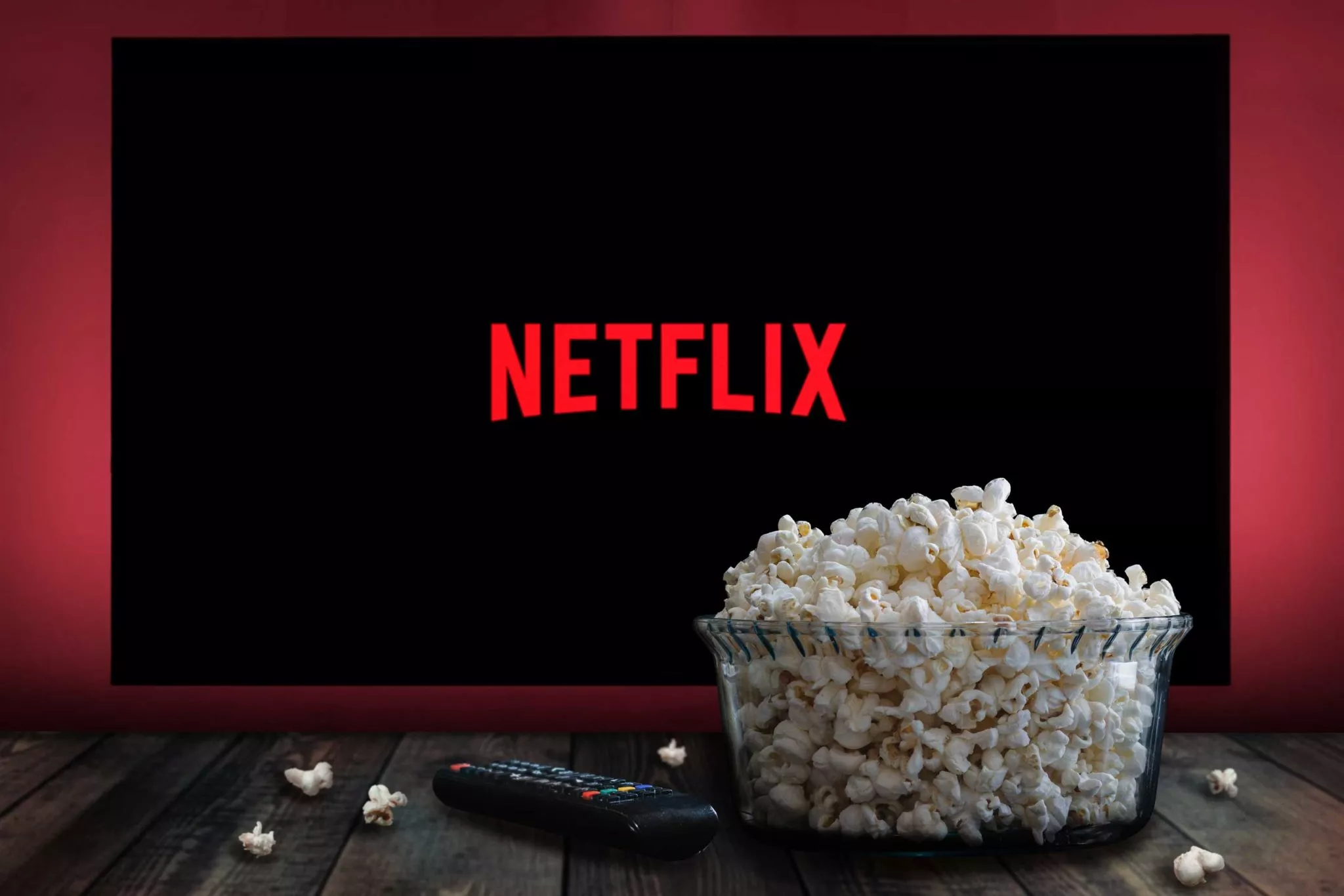Bowl of popcorn in front of TV screen showing Netflix logo